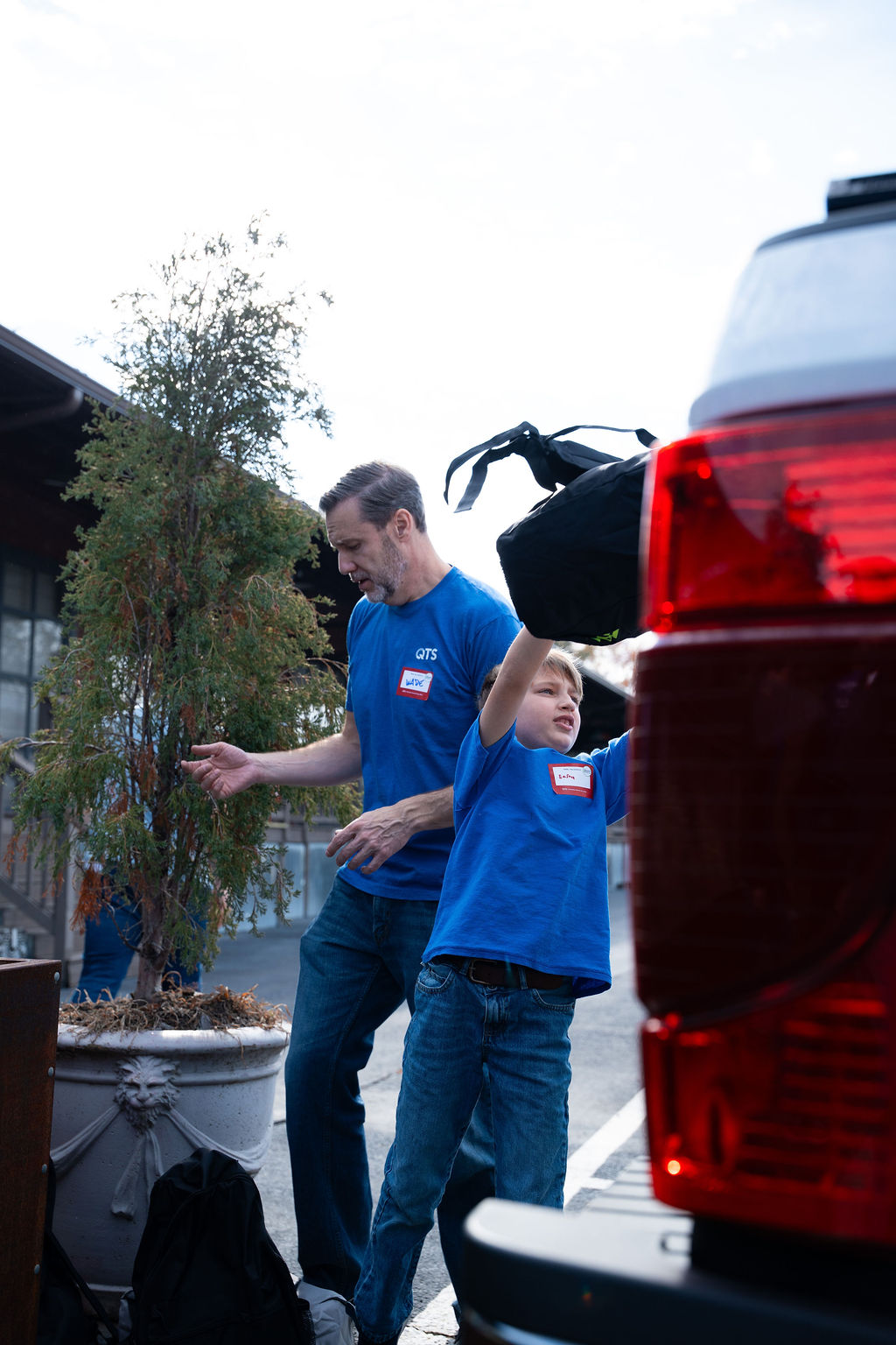 Volunteers load backpacks for delivery.